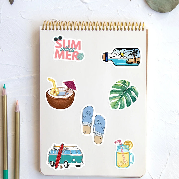 Sticker sheet with summer-themed designs on a notebook
