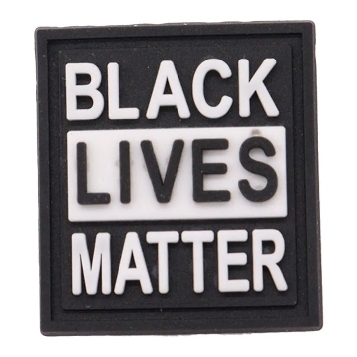 charm of a Black Lives Matter sign with white text on a black background