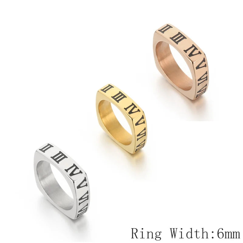 Three rings in gold, silver, and rose gold with Roman numeral engraving on a white background.