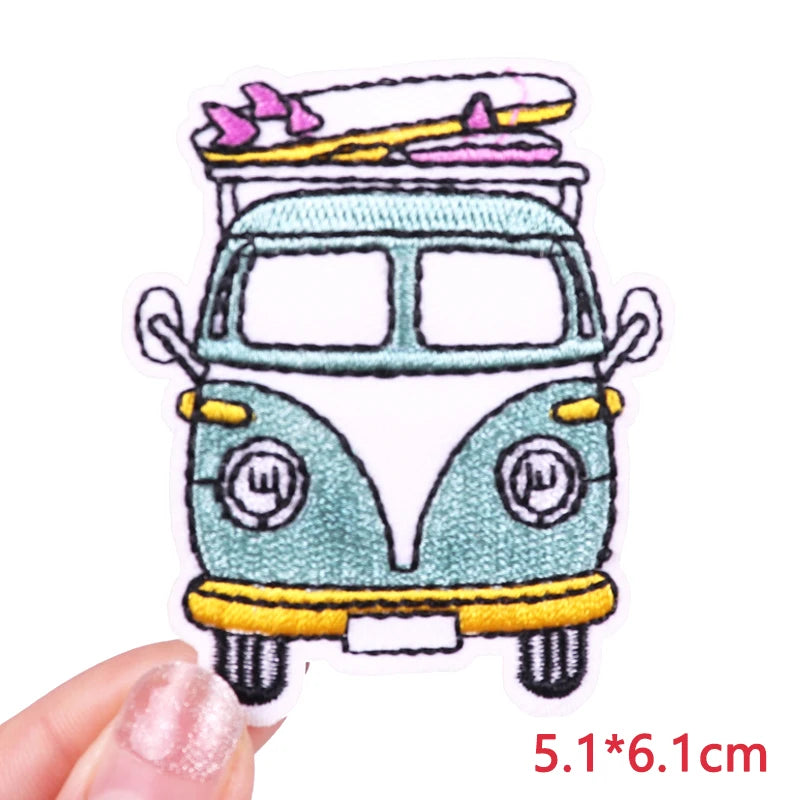 Embroidered patch of a van with surfboards on a white background