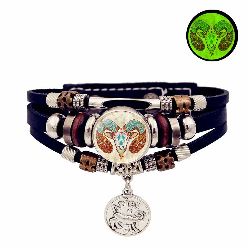 Multistrand bracelet with zodiac charm on a white background