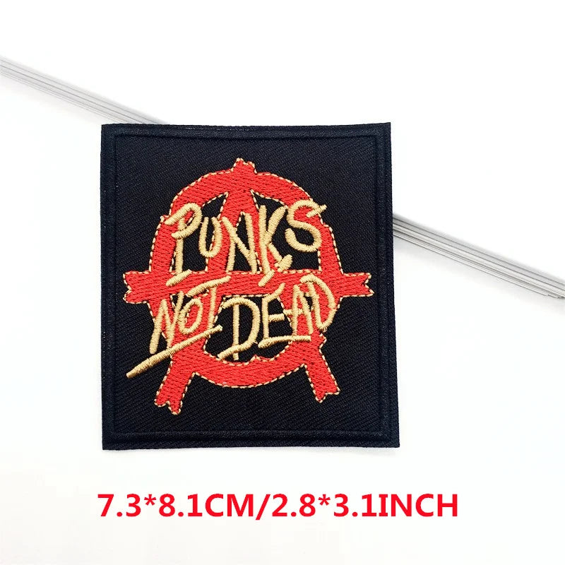 Embroidered patch with 'Punks Not Dead' text on a black background