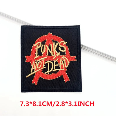 Embroidered patch with 'Punks Not Dead' text on a black background