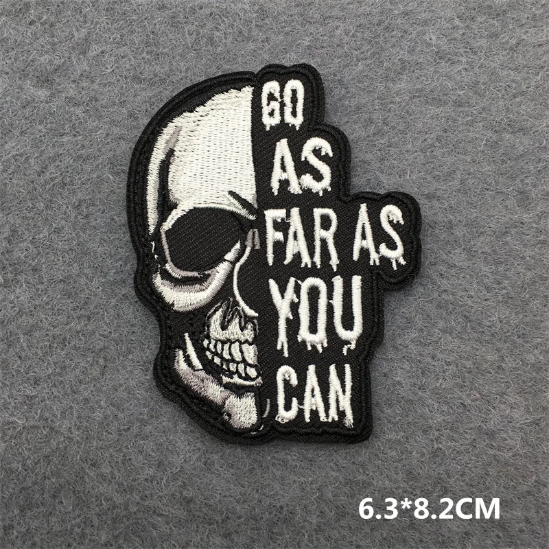 Skull patch with 'Go as far as you can' text on a gray background