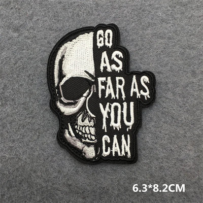 Skull patch with 'Go as far as you can' text on a gray background