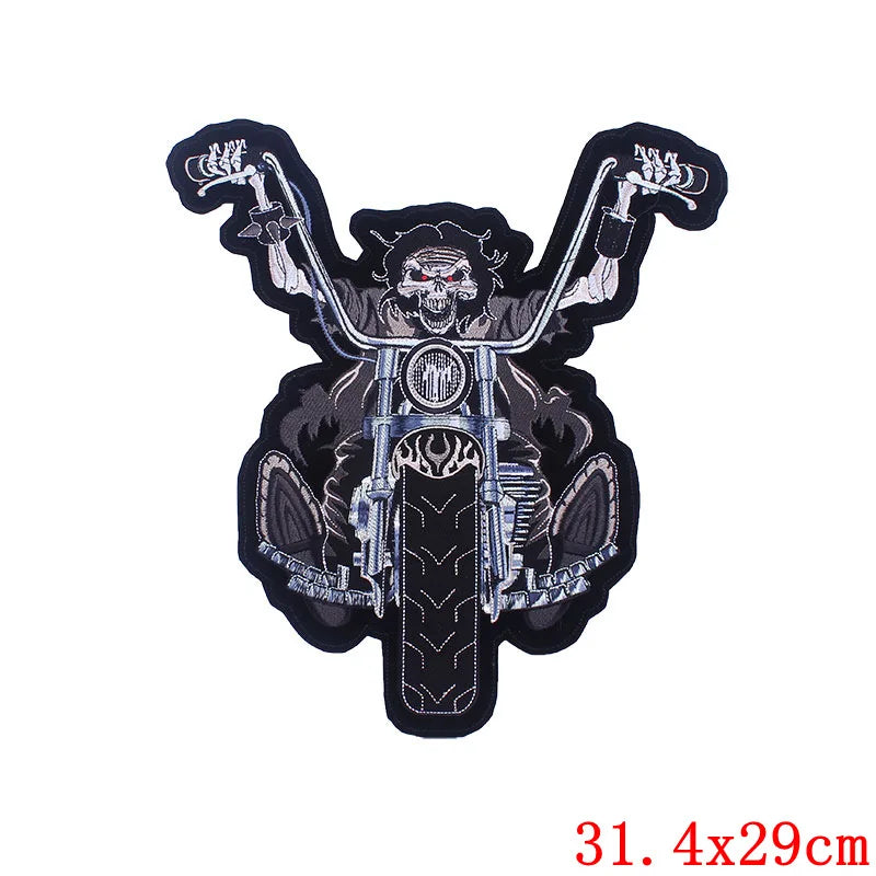 Motorcycle patch with a skull design on a white background