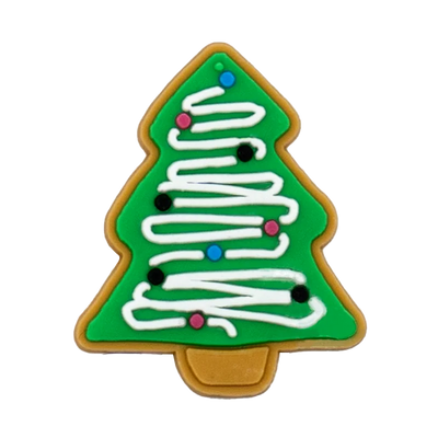 Shoe charm ornament of Christmas tree-shaped cookie with green background, white icing, and colorful decorations on a white background