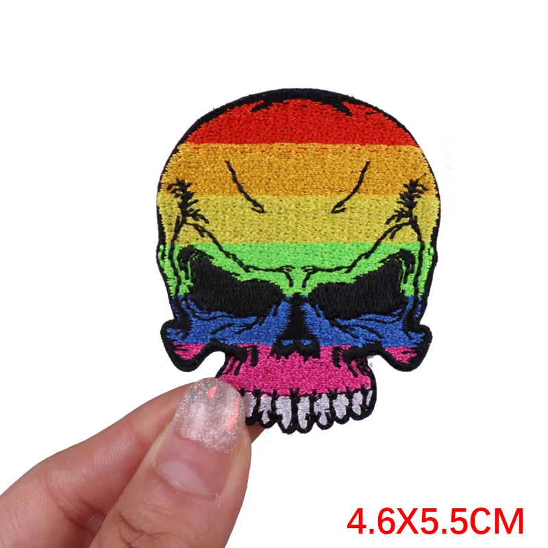 Colorful skull patch held by a hand with a white background