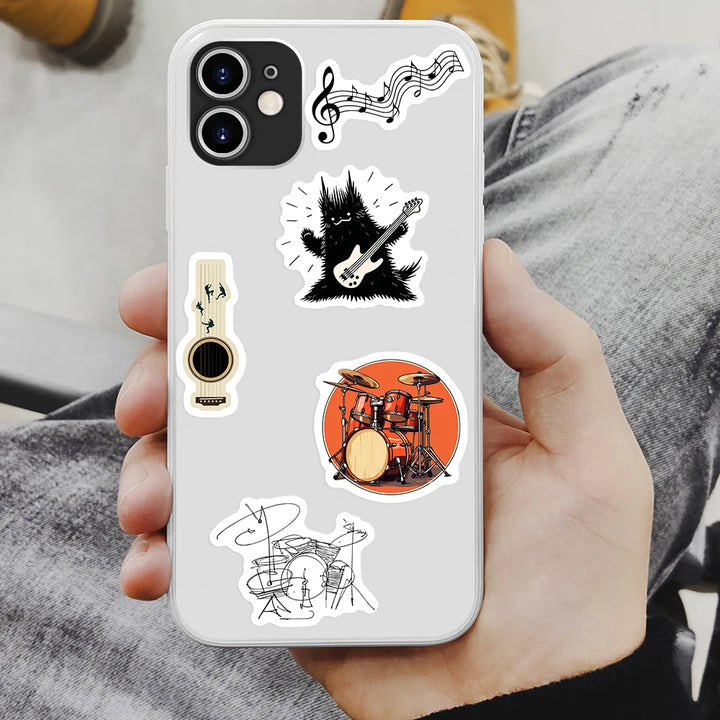 Phone case with musical instrument stickers held by a person