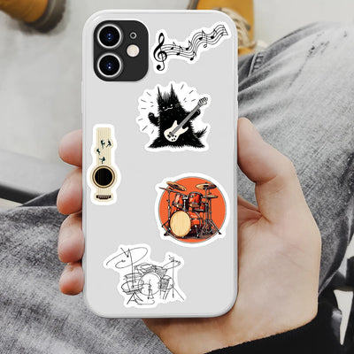 Phone case with musical instrument stickers held by a person
