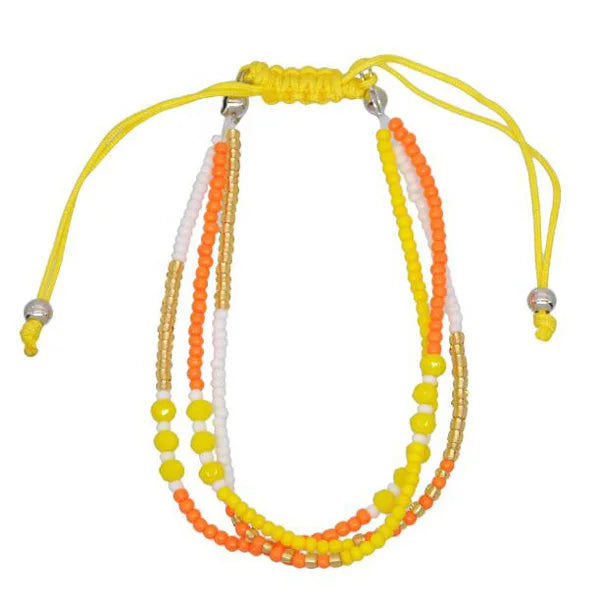 Multistrand beaded necklace with yellow, orange, and white beads on a white background