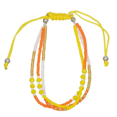 Multistrand beaded necklace with yellow, orange, and white beads on a white background