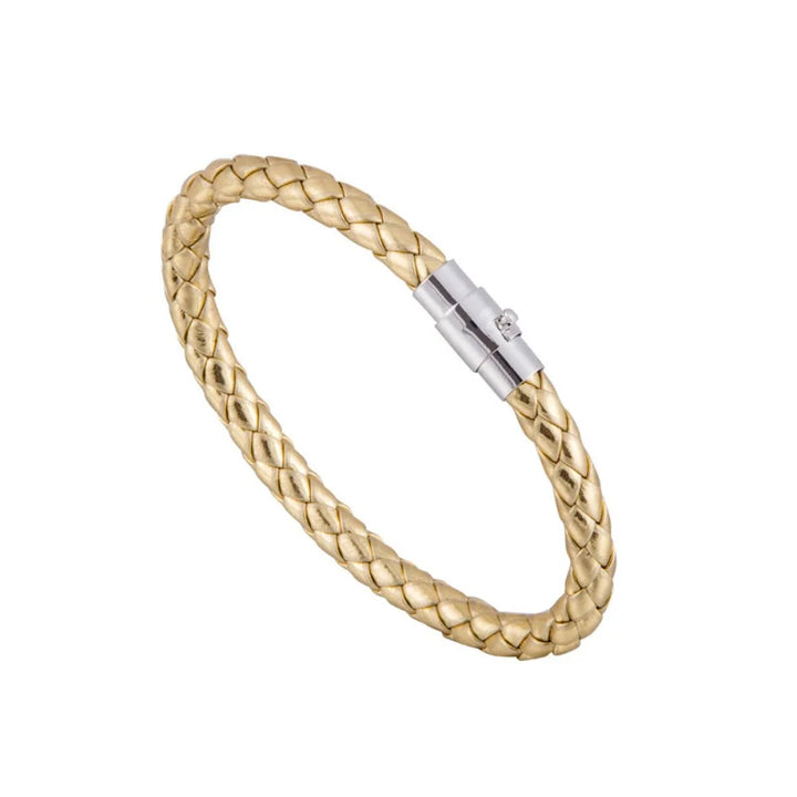 Gold braided bracelet with a silver clasp on a white background