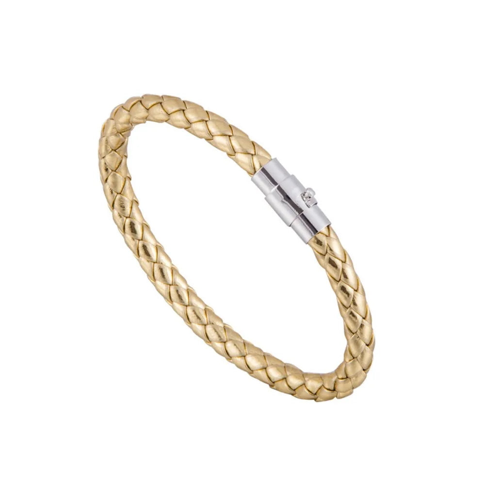 Gold braided bracelet with a silver clasp on a white background