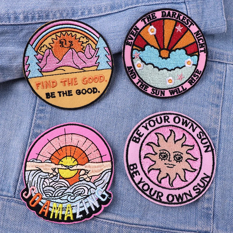 Four motivational patches on a denim background