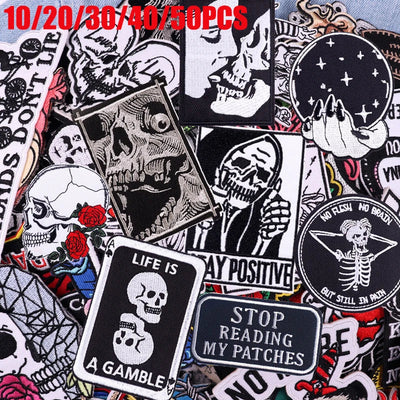 Collection of various skull-themed patches with text on a colorful background.