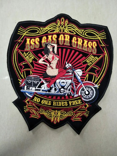 Decorative patch with motorcycle and woman design on a white background