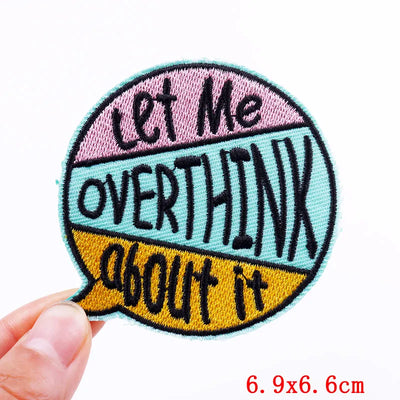 Embroidered patch with text 'Let Me Overthink About It' held by a hand on a white background.