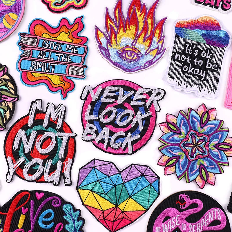 Collection of colorful patches with various designs and text