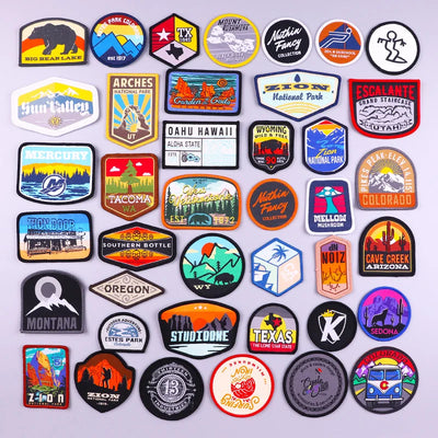 Collection of various colorful patches with different designs on a white background
