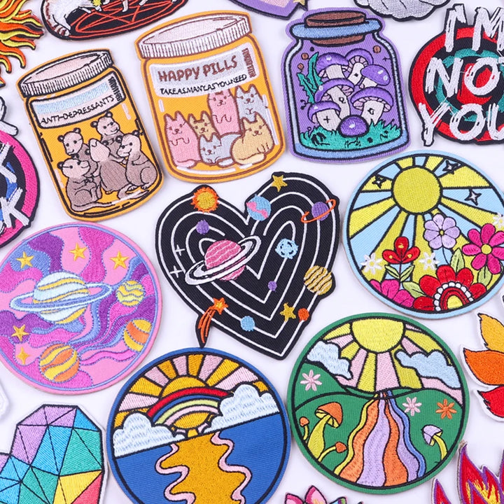Collection of colorful patches with various designs on a white background