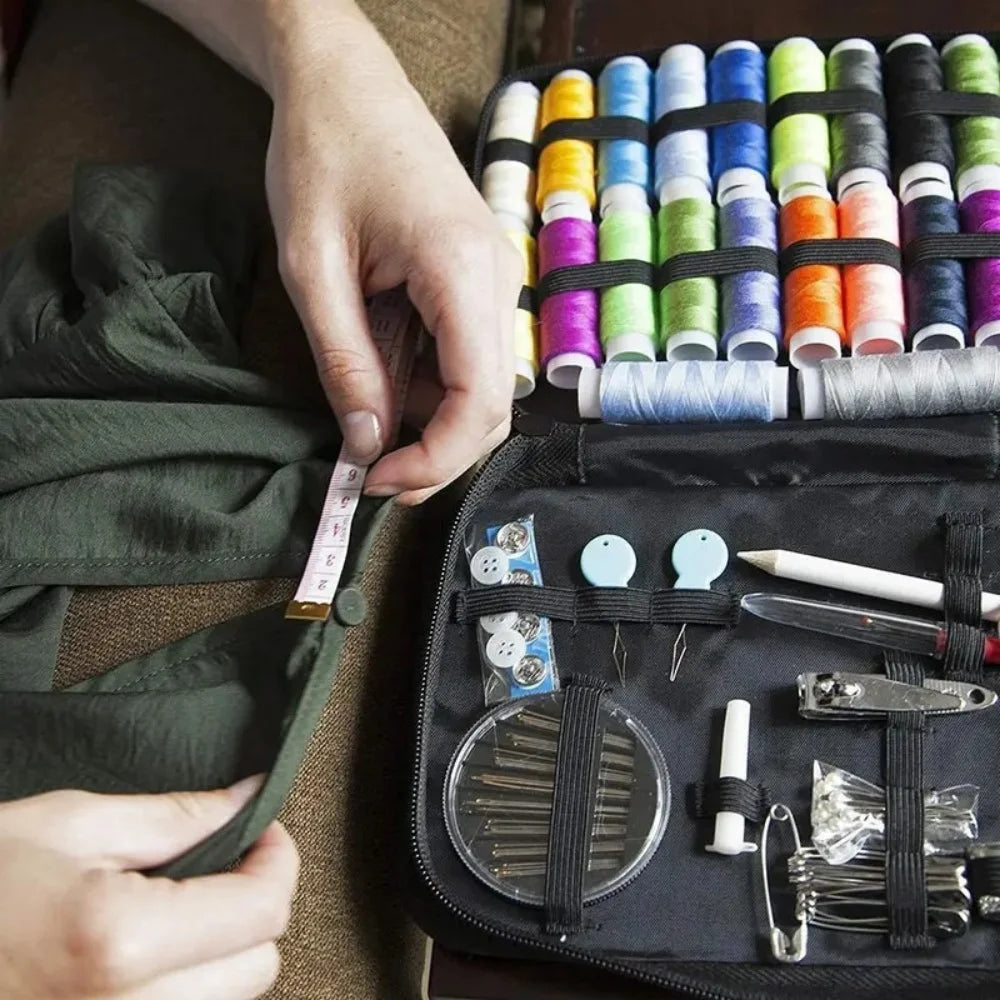Person working with sewing tools and thread in a black case