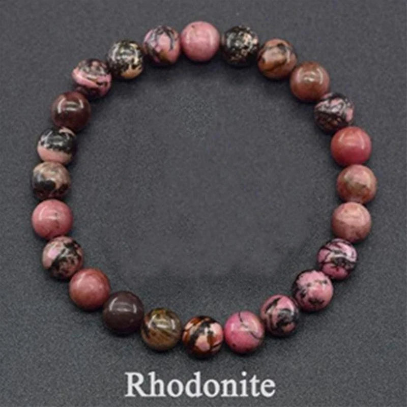 Rhodonite beaded bracelet on a dark gray background