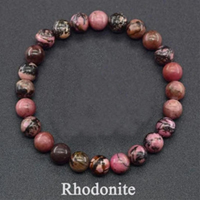 Rhodonite beaded bracelet on a dark gray background