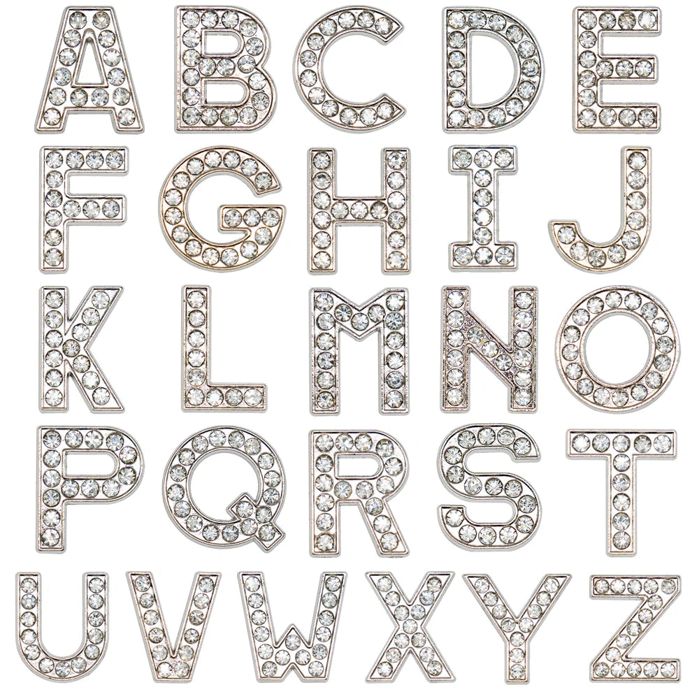 Silver rhinestone letters shoe charms on a white background