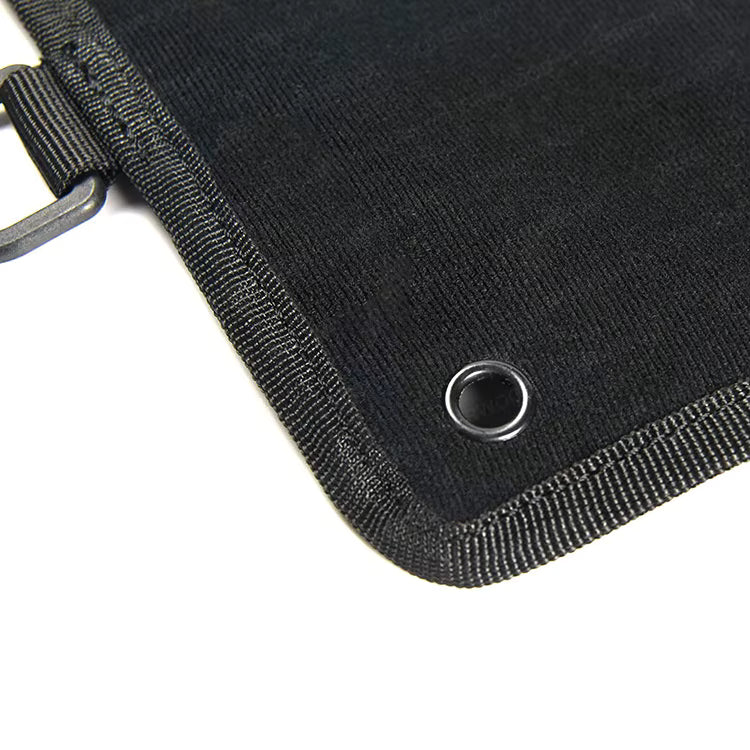 Close-up of black patch display boards showing edges and corner structure on a white background