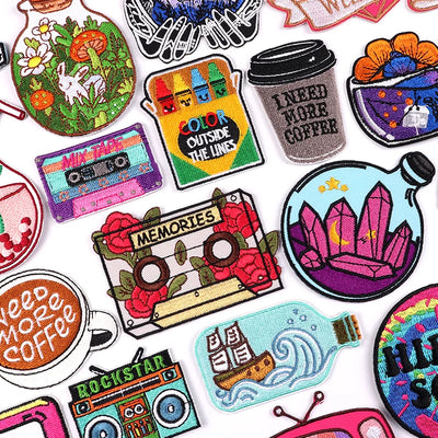 Collection of colorful embroidered patches with various designs on a white background