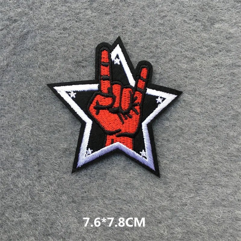 Patch with a hand making a peace sign inside a star on a gray background