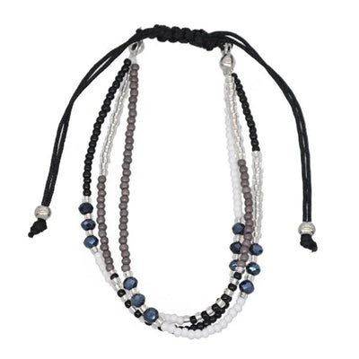 Multistrand beaded necklace with black, gray, and white beads on a white background