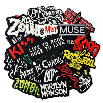 Music band patches including Kiss, Muse, and Marilyn Manson and others on a white background.