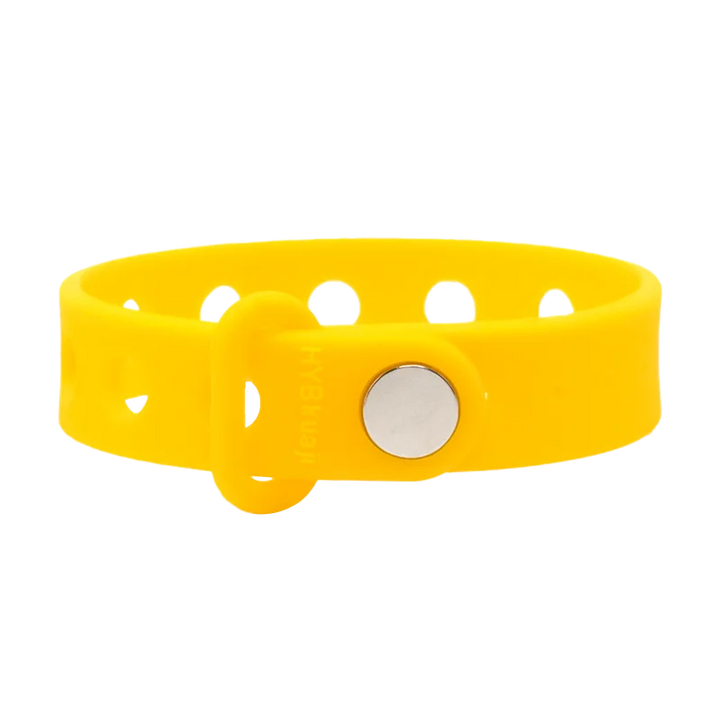 Yellow wrist band with a silver buckle on a white background