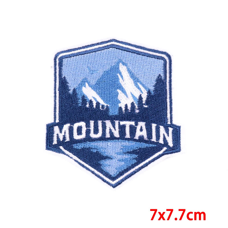 Embroidered patch with mountain design and 'Mountain' text on a white background