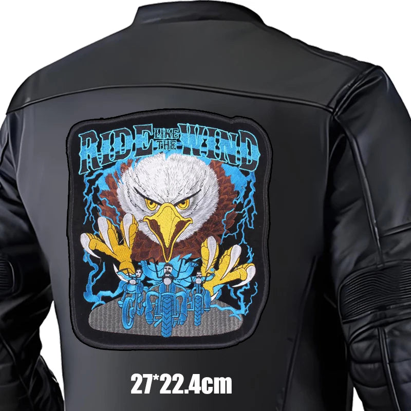 Black leather jacket with an eagle patch and 'Ride Like the Wind' text on a white background