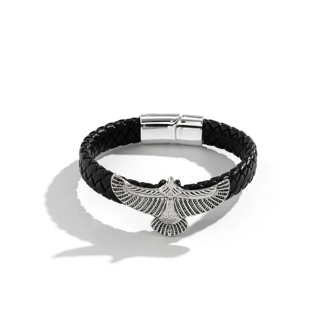 Black braided leather bracelet with silver eagle pendant on a white background