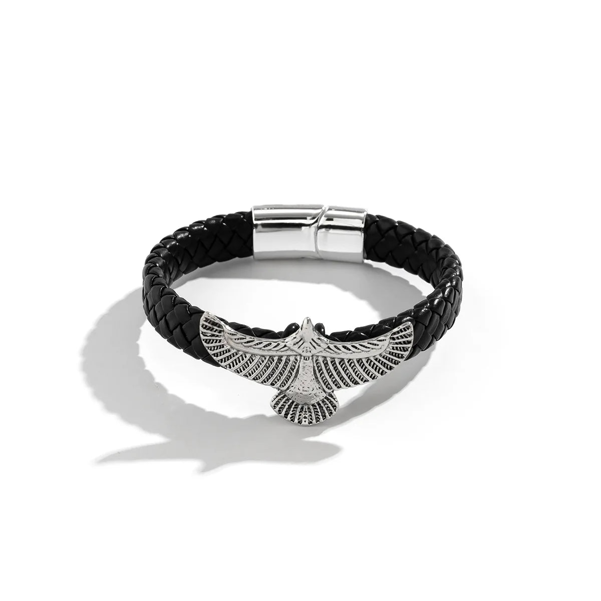 Black braided leather bracelet with silver eagle pendant on a white background