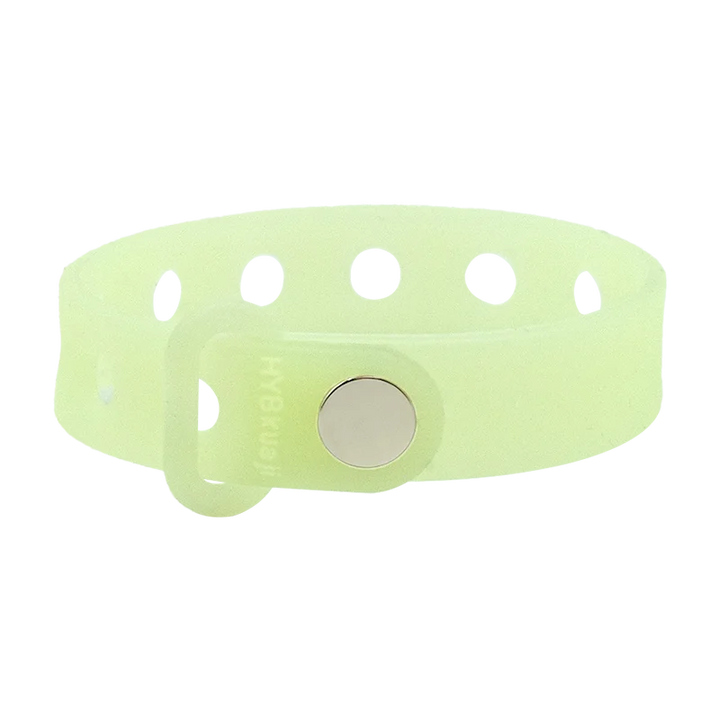 Luminous green wrist band with a central round metal component on a white background