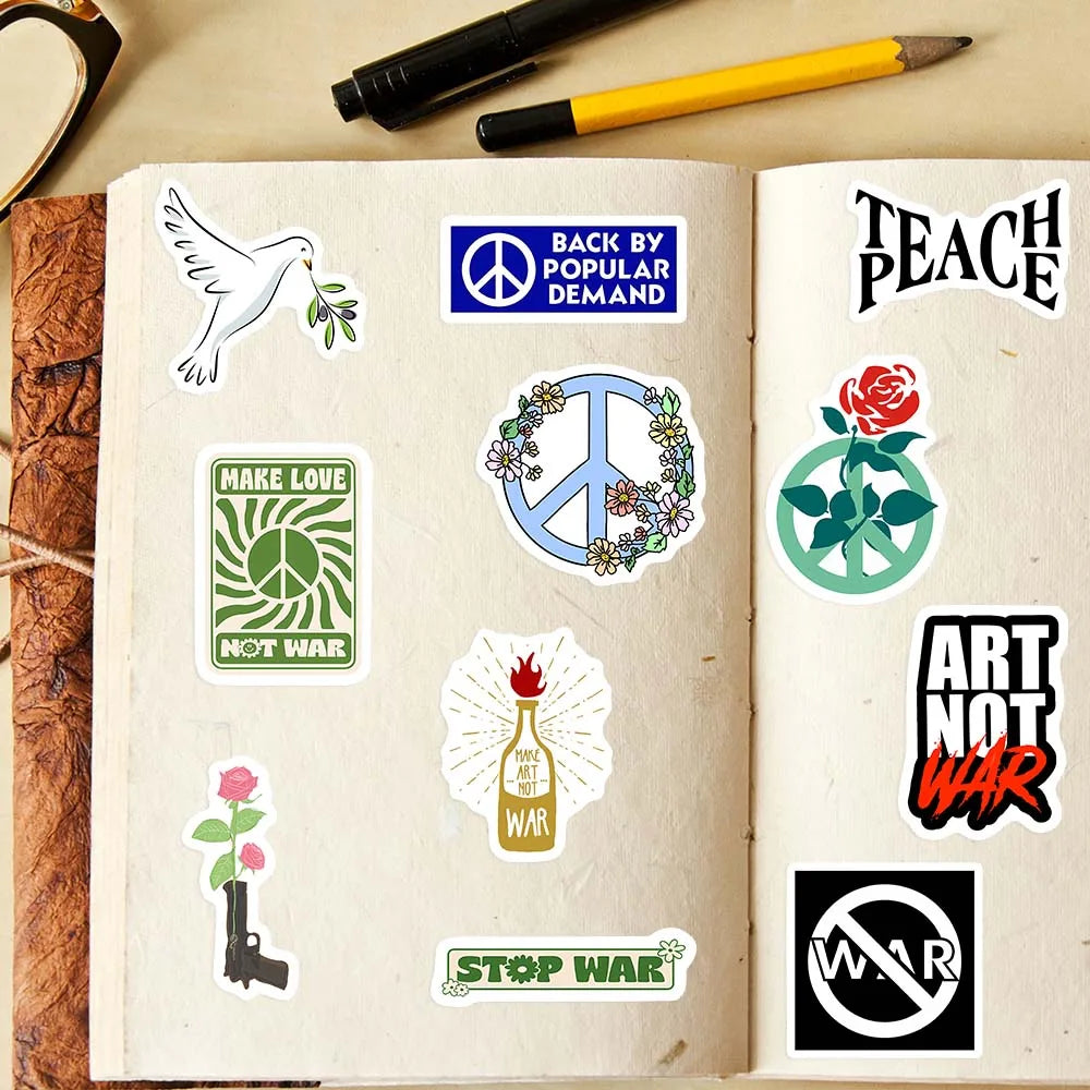 Open notebook with various peace-themed stickers on a wooden surface.