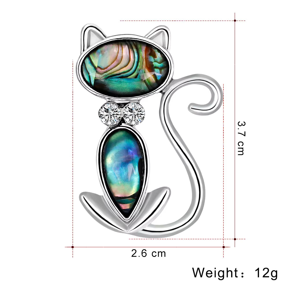 Cat-shaped brooch with gemstones and dimensions on a white background