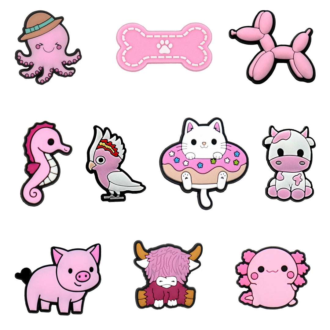 Collection of cute pink animal and object shoe charms on a white background