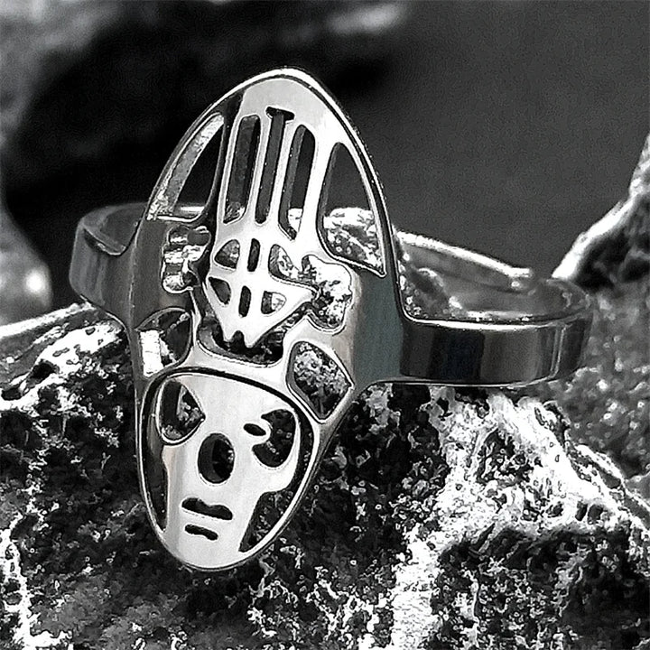 Silver ring with a unique design on a textured surface