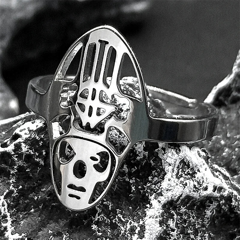 Silver ring with a unique design on a textured surface