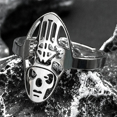 Silver ring with a unique design on a textured surface