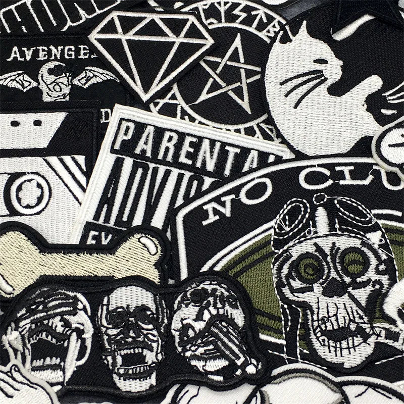 Collection of various patches with different designs including skulls, text, and symbols.