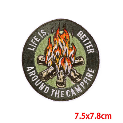 Round patch with campfire design and text 'Life is better around the campfire' on a white background.