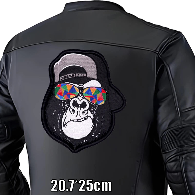 Black leather jacket with a gorilla patch wearing colorful sunglasses on a white background
