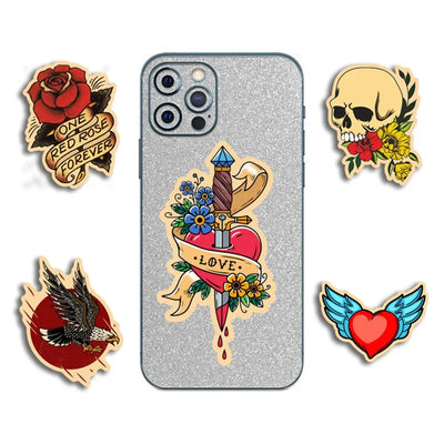 Phone case with decorative stickers featuring tattoos and floral designs on a white background